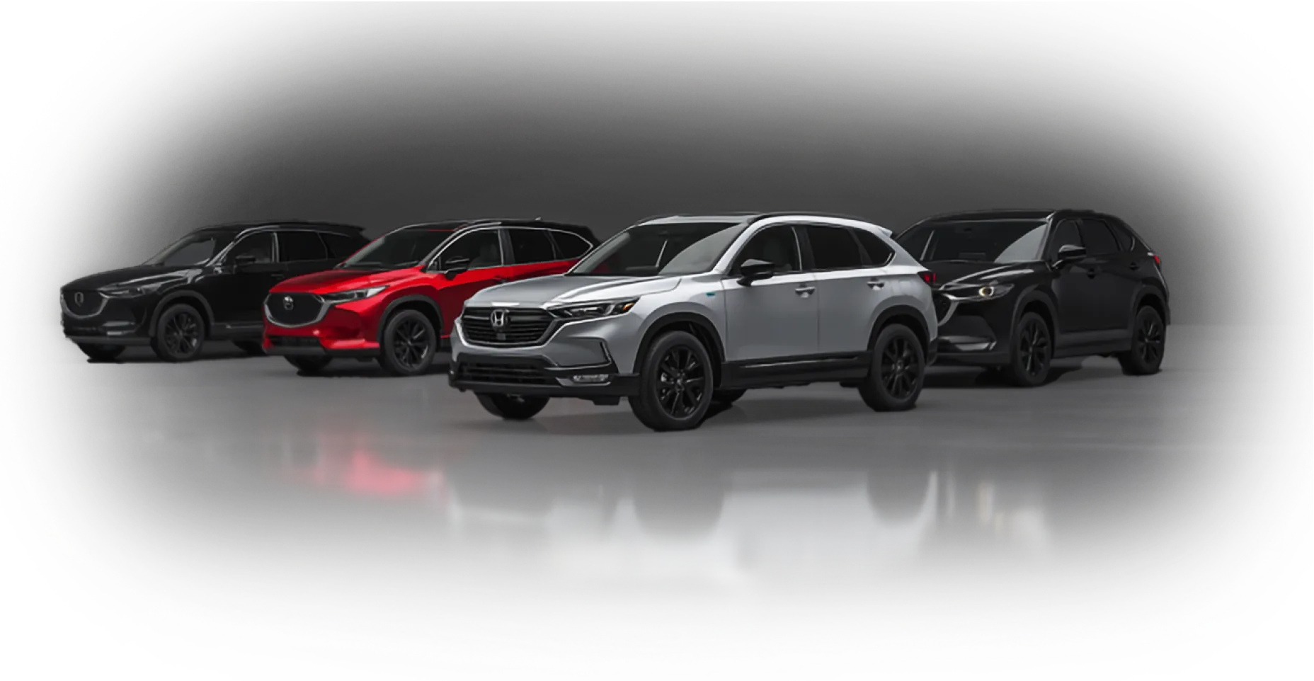 Row of black, red, and silver SUVs